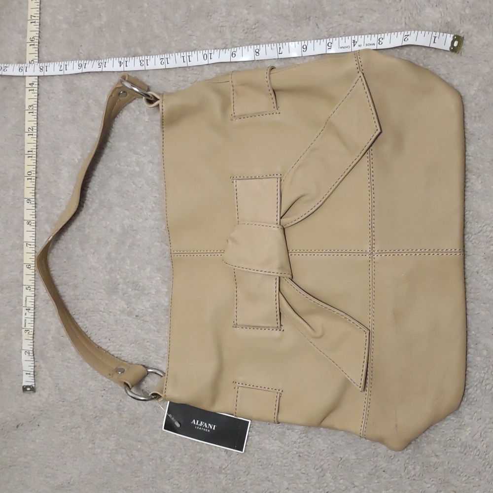 BNWT Alfani tan bag with bow detail on the front orig. $138